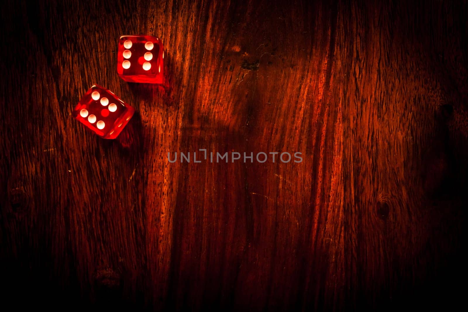 Two red dices showing a pair of sixes