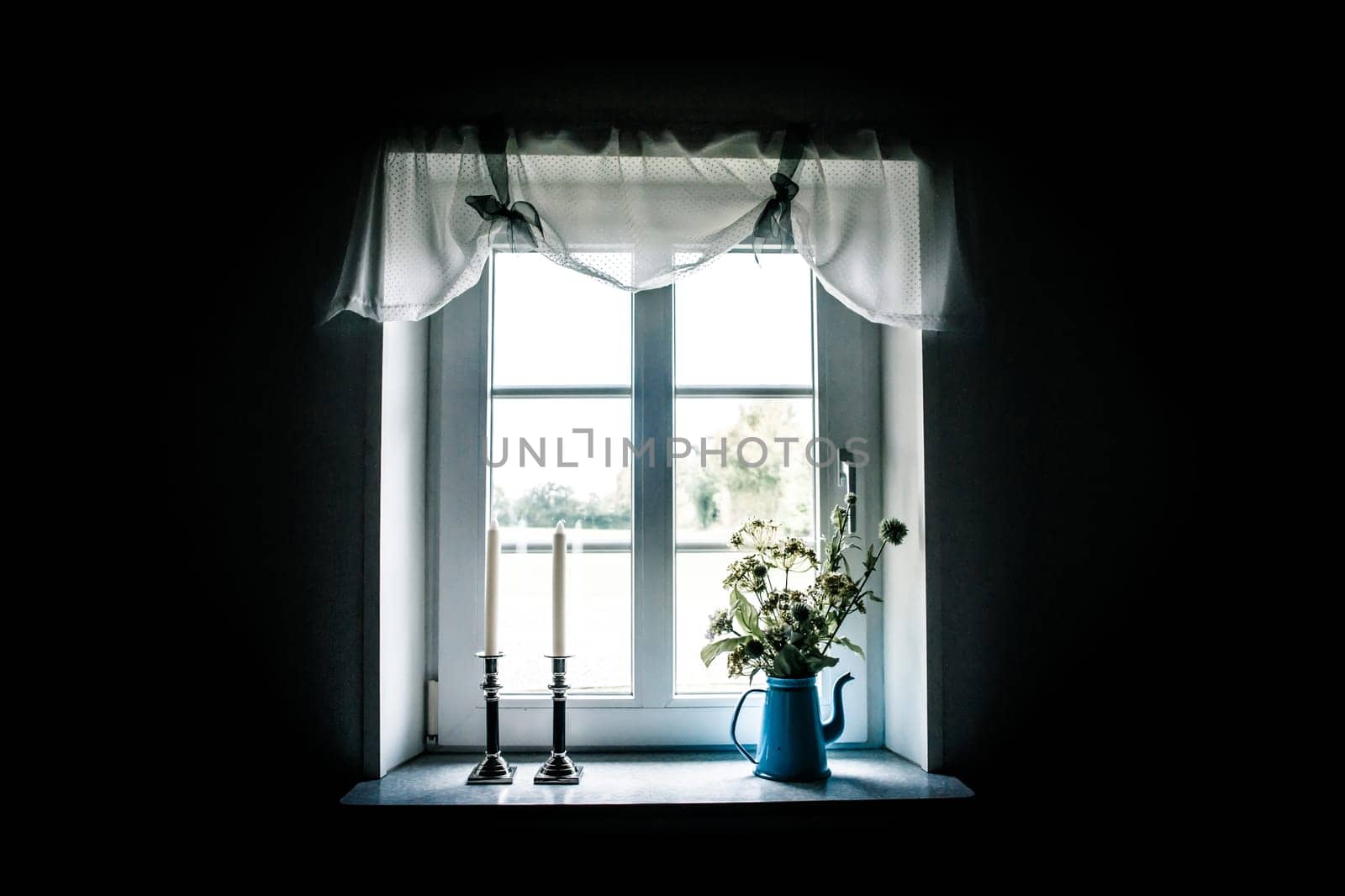 Romantic window with beautiful curtains and decorations