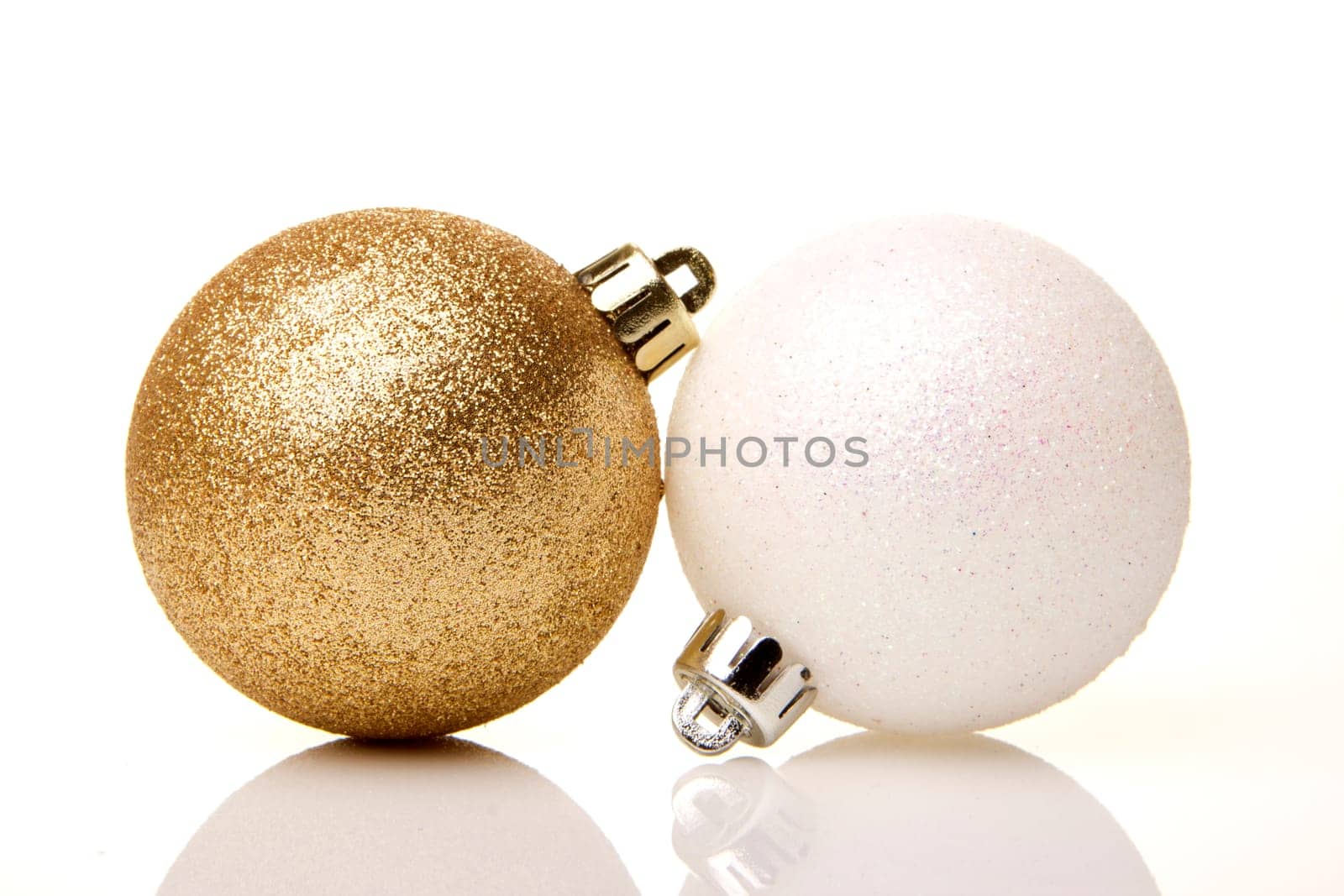 Christmas,golden and white baubles insulated with white background