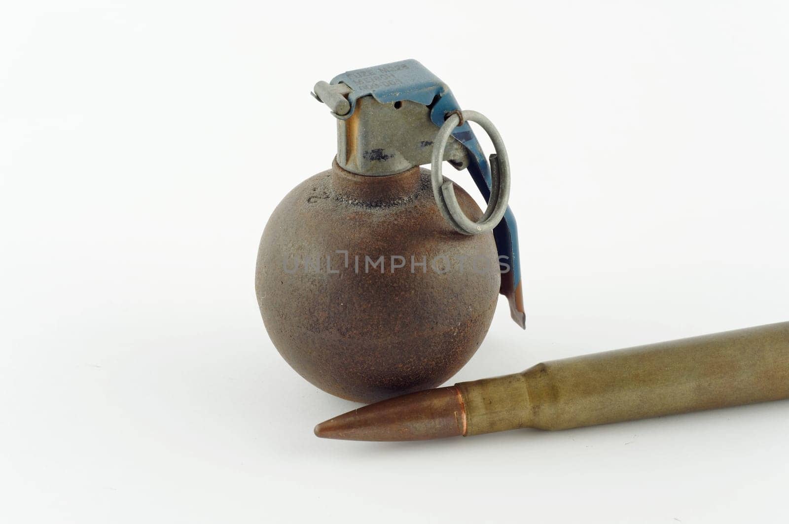 Old grenade with a horizontal cartridge insulated on white