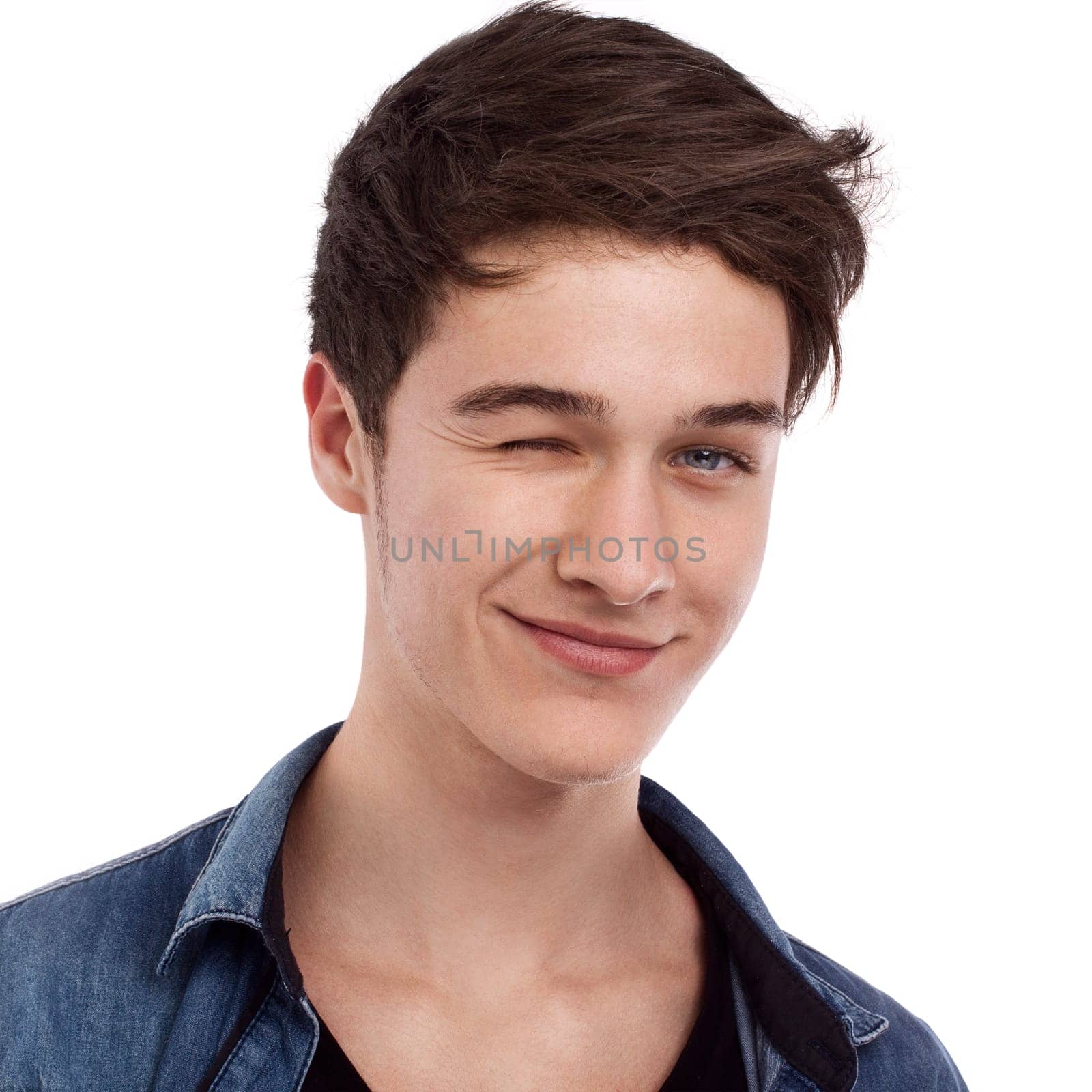 Young charming man looking ahead and twinkling