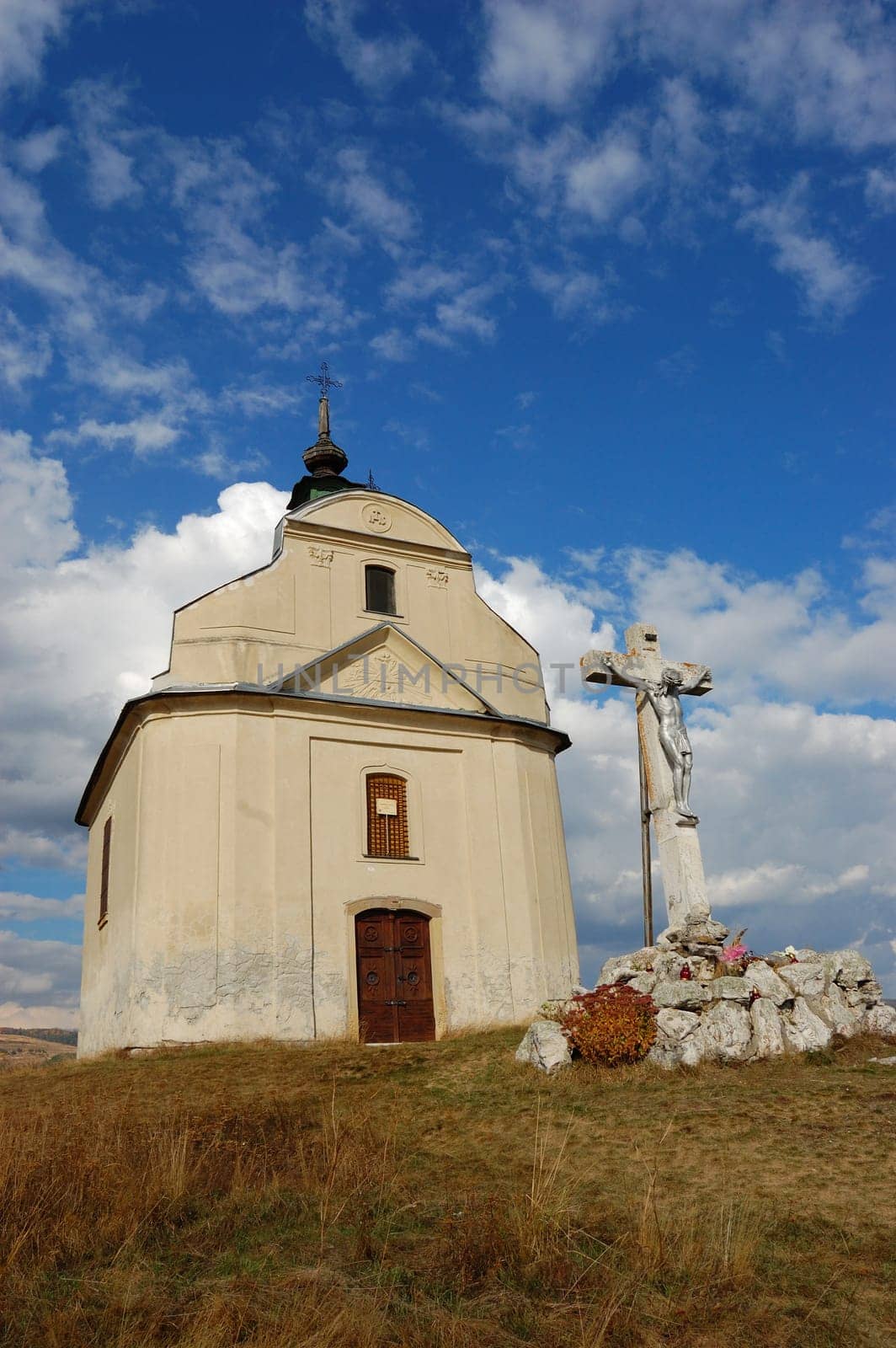 Chapel with cross on hill