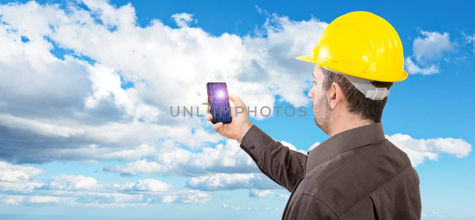Engineer with a helmet on his head, reflecting staring into the void holding a pencil under her nose