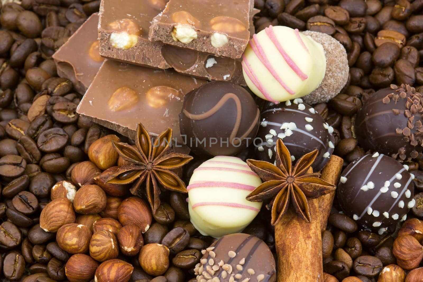background with chocolate, coffee, spices and nuts