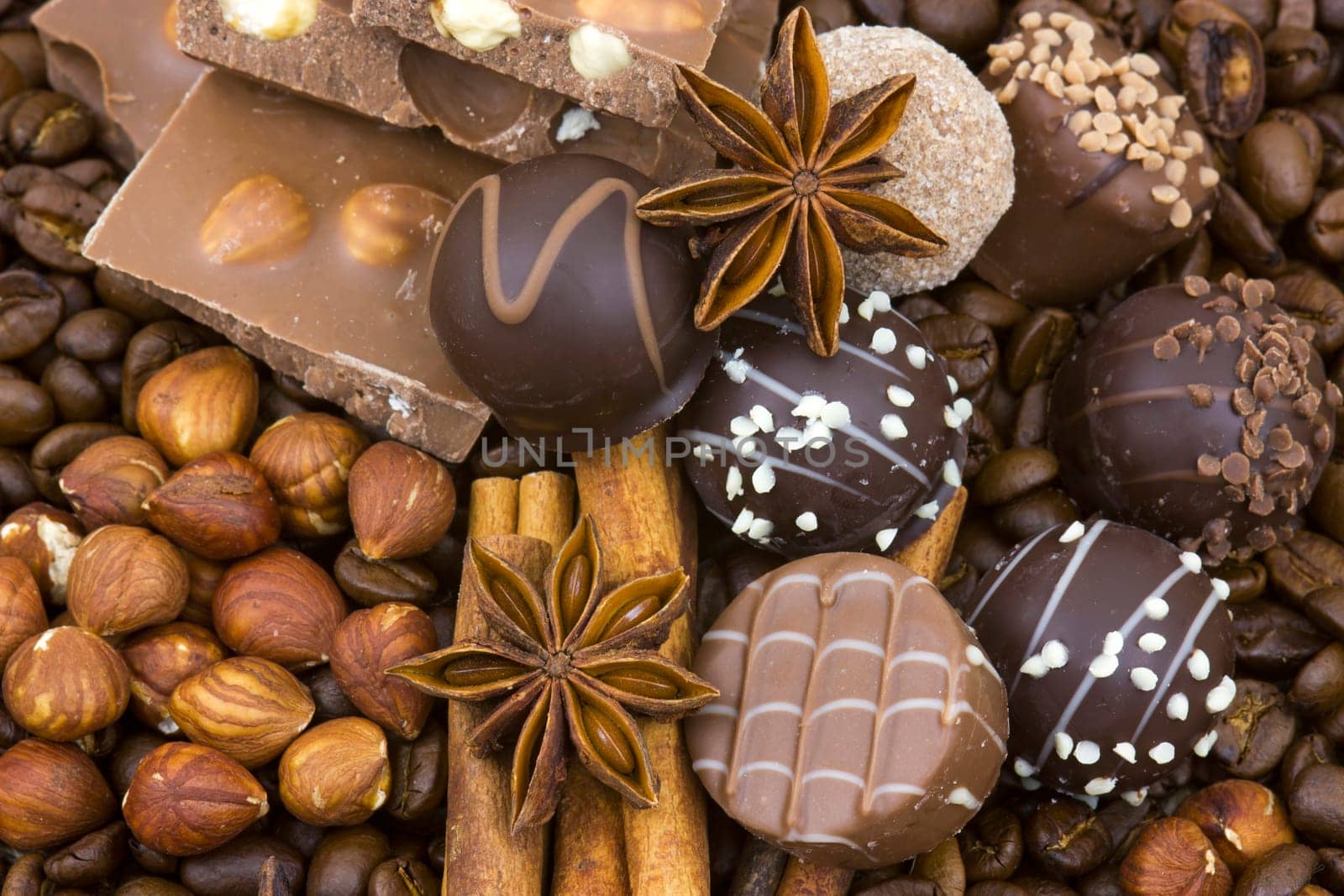 background with chocolate, coffee, spices and nuts