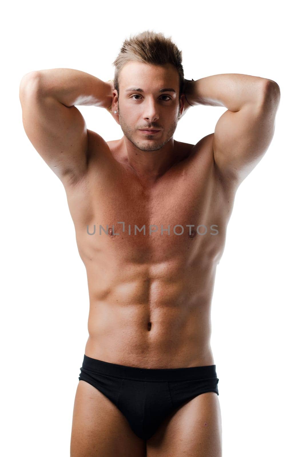 Handsome young muscular man showing ripped abs, isolated on white