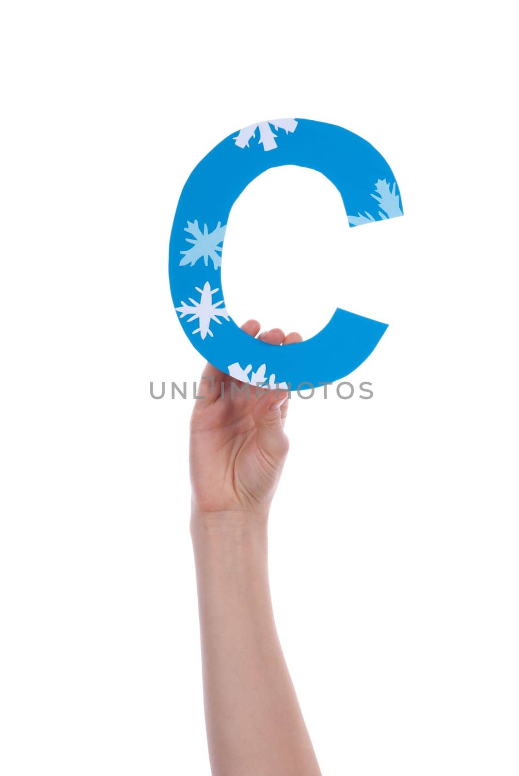 A Hand Holding a Blue and Snowy C, Isolated