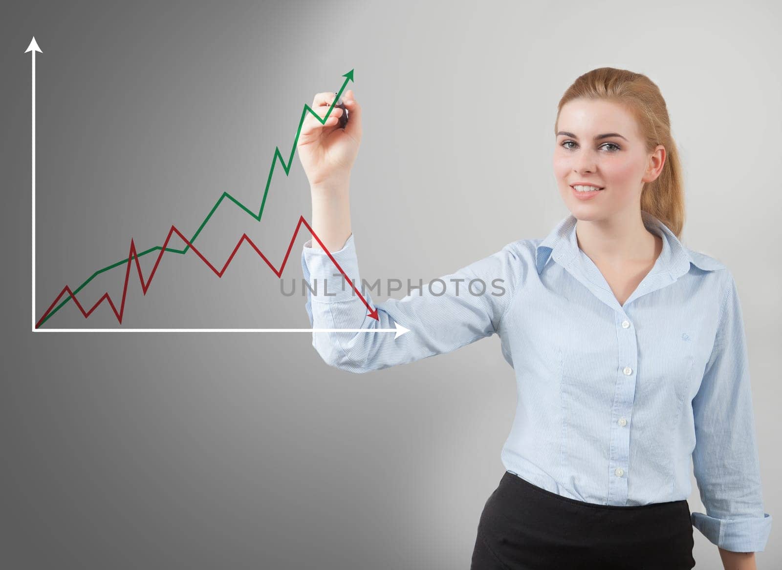 Handwritten chart by businesswoman on glass