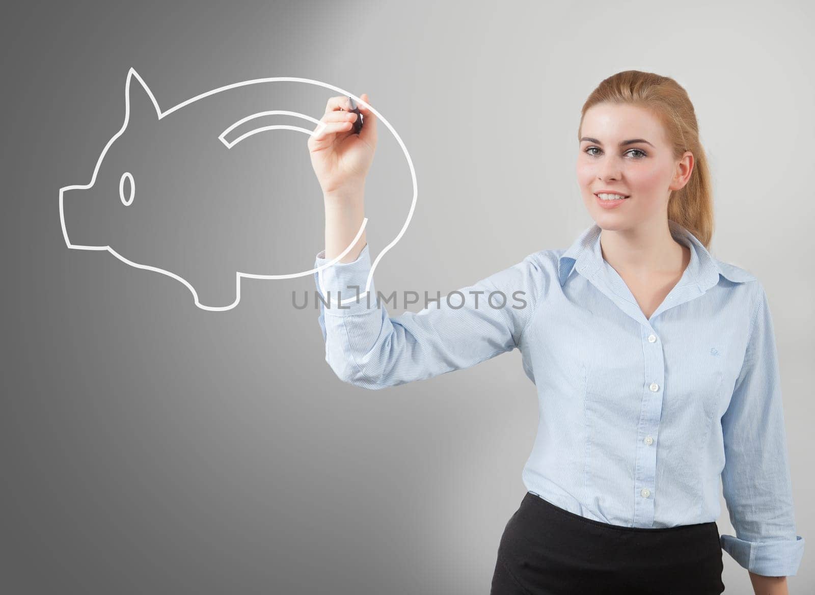 woman hand drawing a piggy bank, grey background