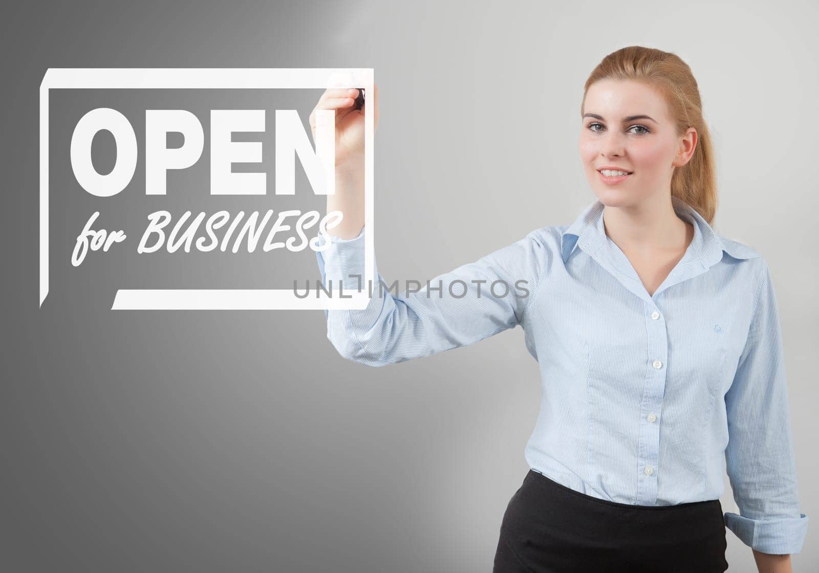 open for business sign hand drawn on to the screen by businesswoman