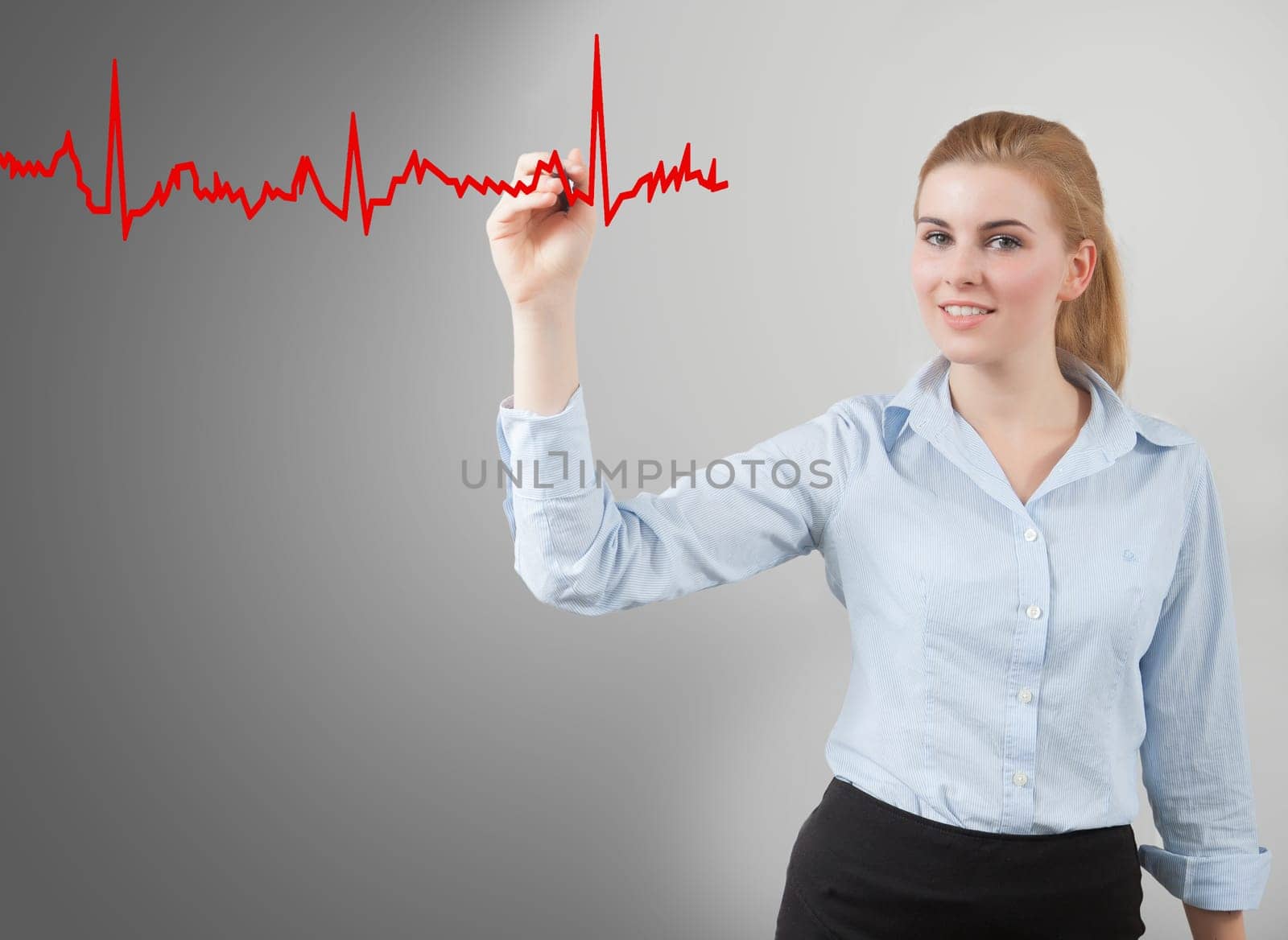 business woman hand drawing hearth graph, grey background