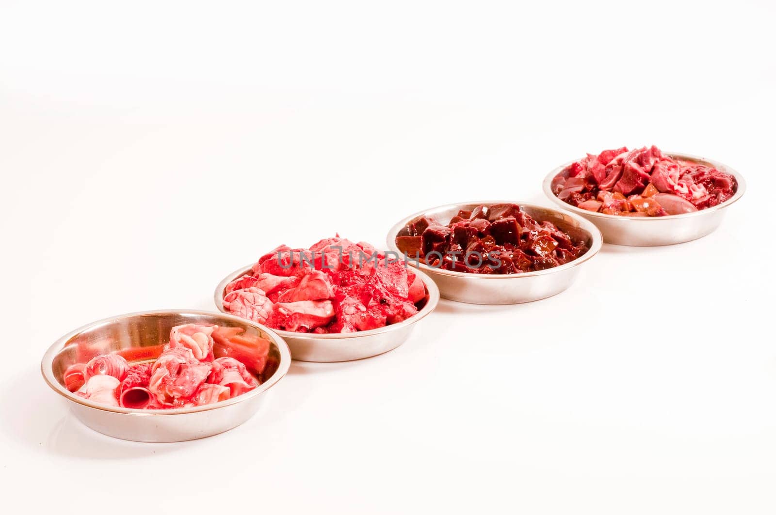fresh cut offal (liver,lungs,heart,throat,spleen) for raw feeding in stainless steel bowls