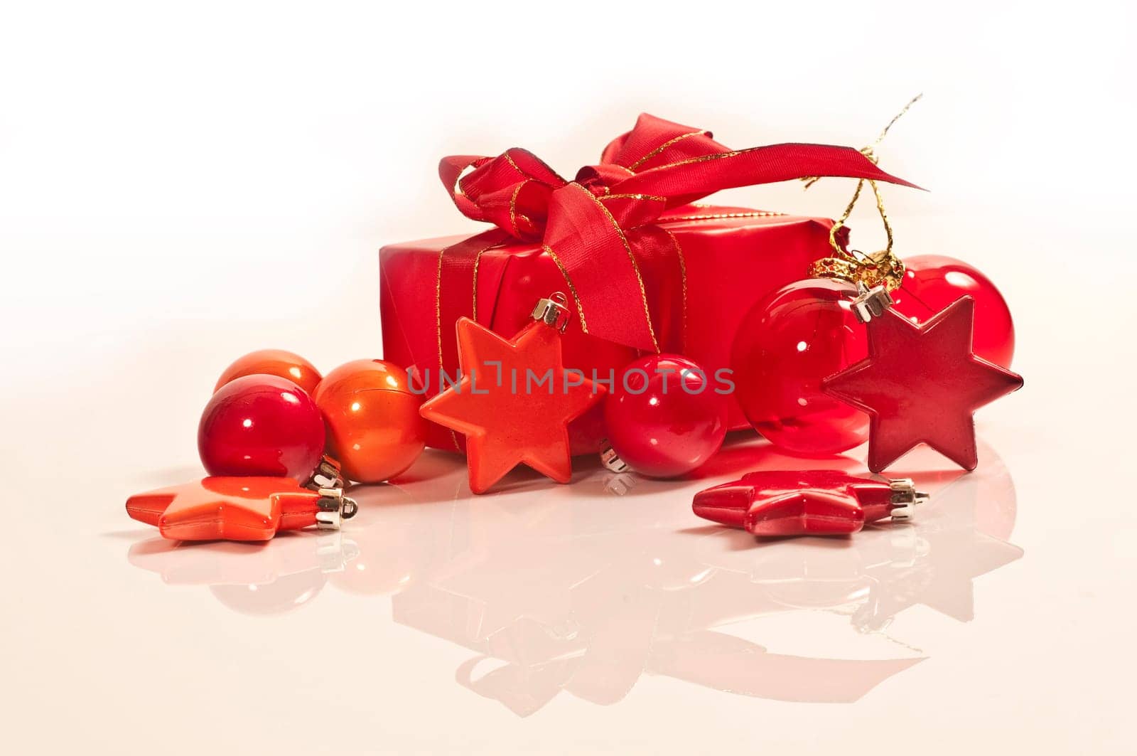 Christmas gifts with Christmas decoration in red,orange and pink on white background