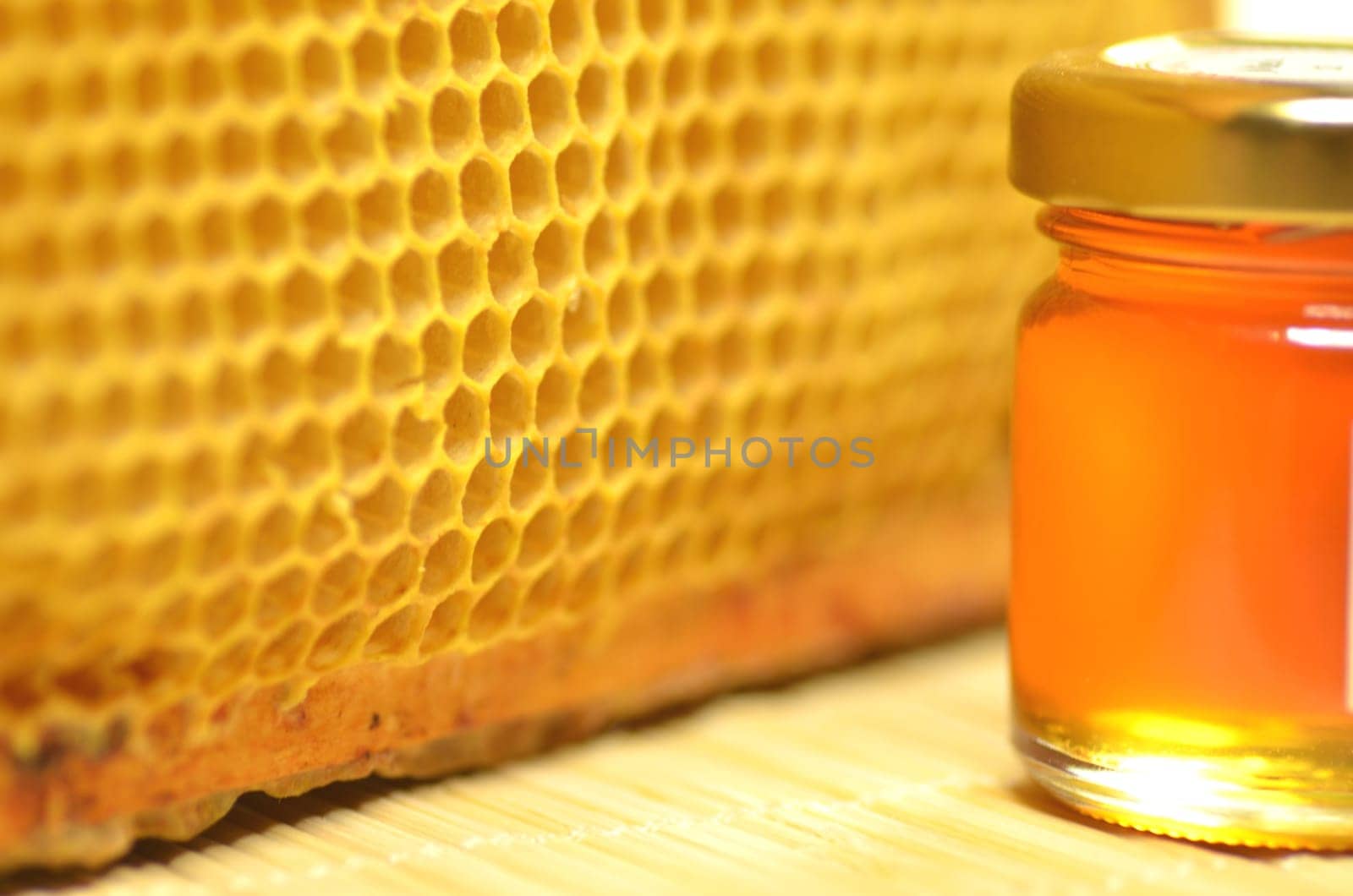 jar full of fresh delicious honey with natural honeycomb