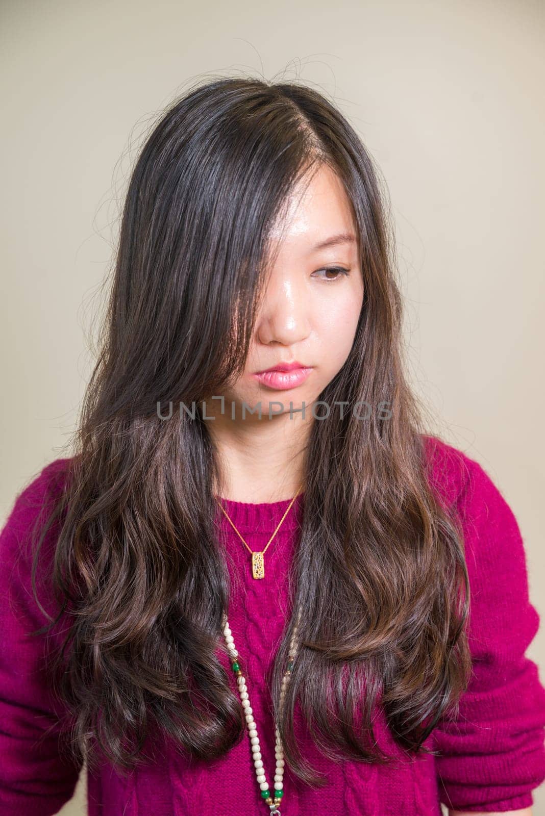 Portrait of young woman looking stressed out
