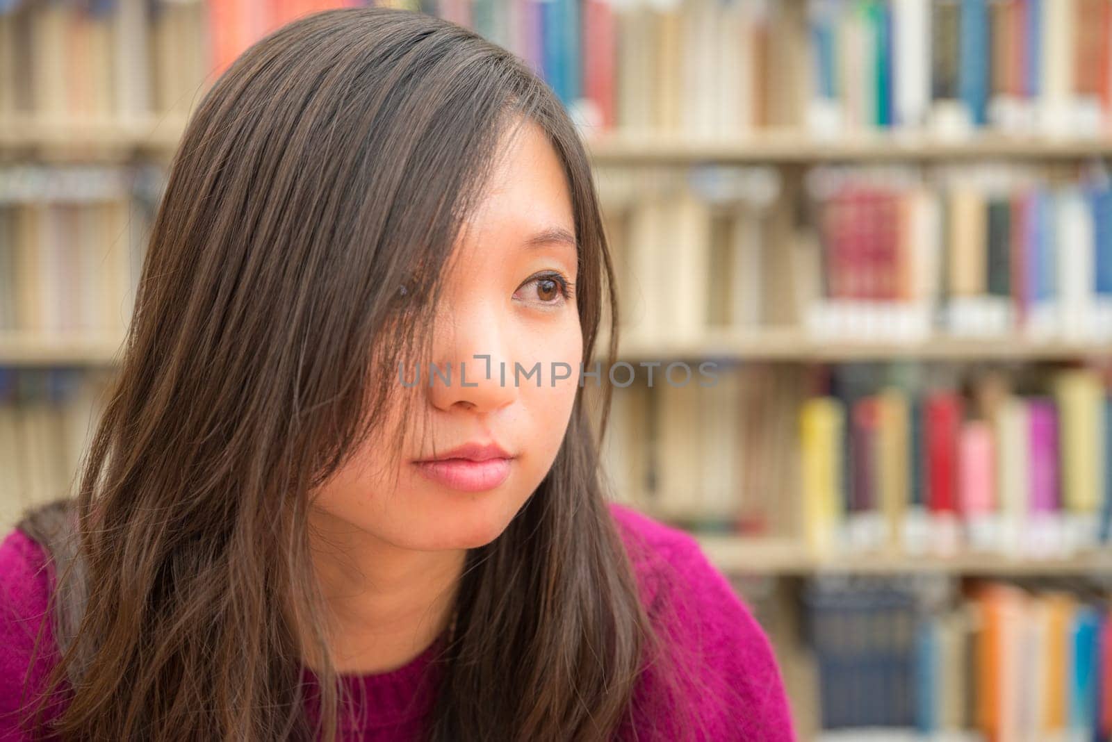 Close portrait of young woman in library