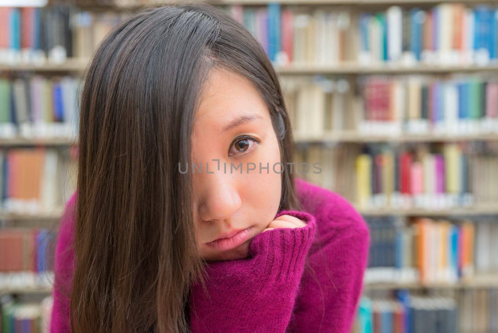 Close portrait of young woman in library