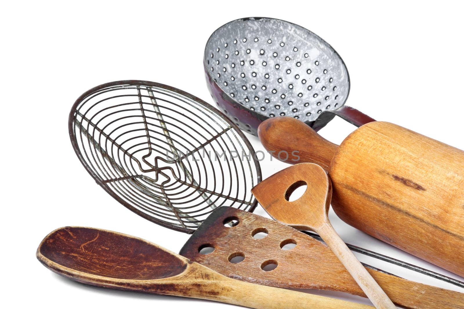 Different wooden spoons and rolling pin
