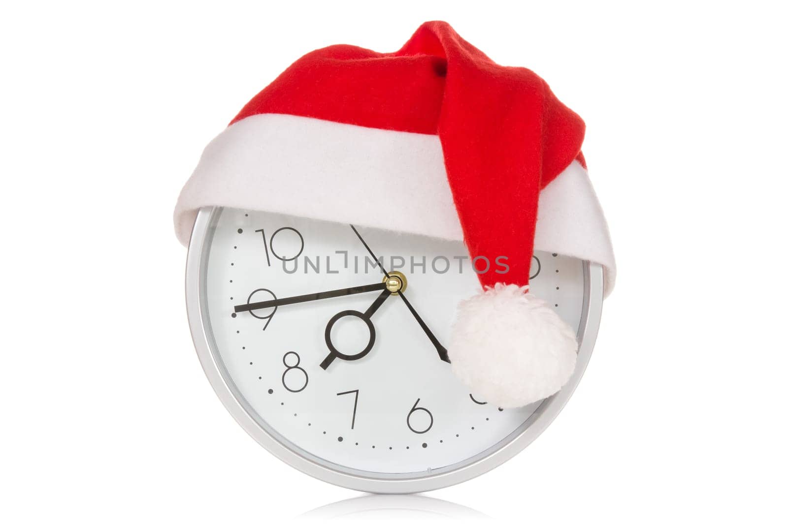 Clock with christmas santa hat. Isolated on white background