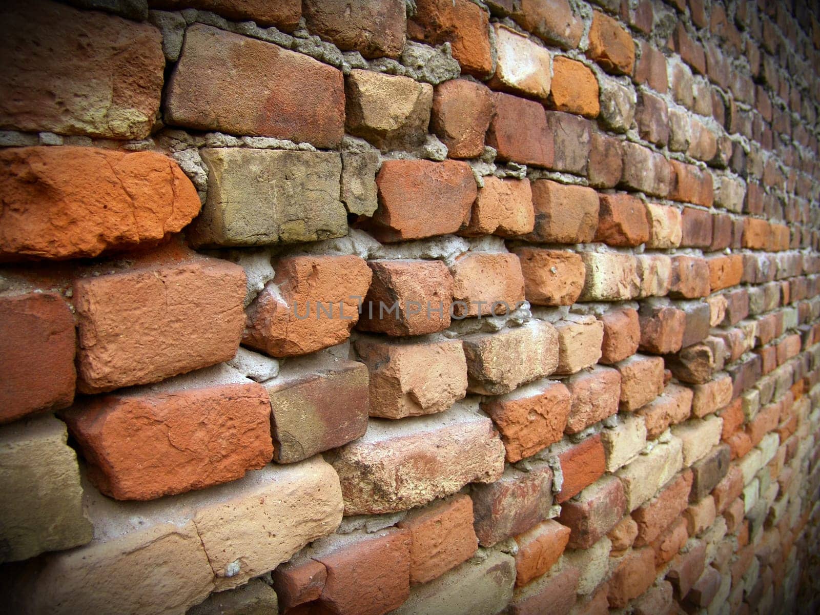 The old red brick macro wall with black framework