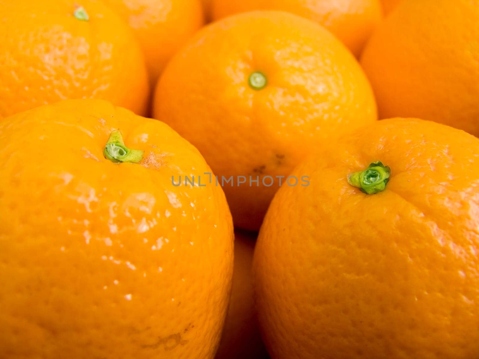 Agricultural background  a pile of beautiful oranges