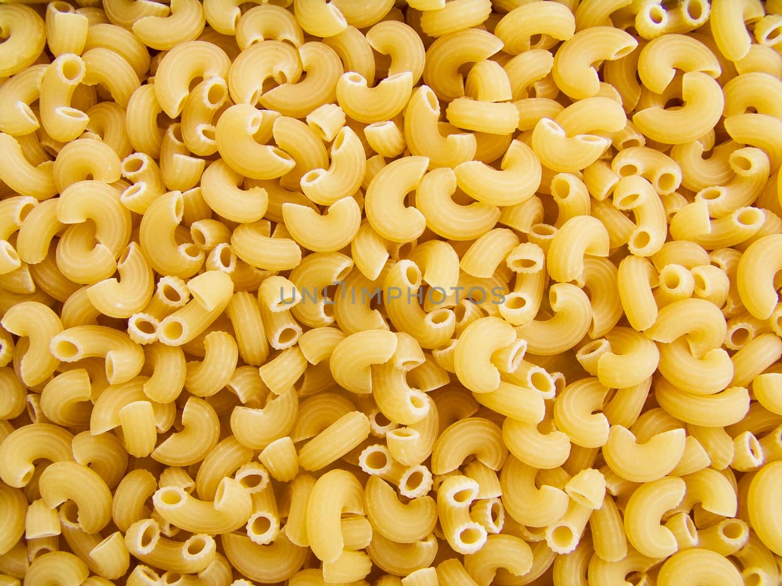 food background a pile of beautiful pasta small horns