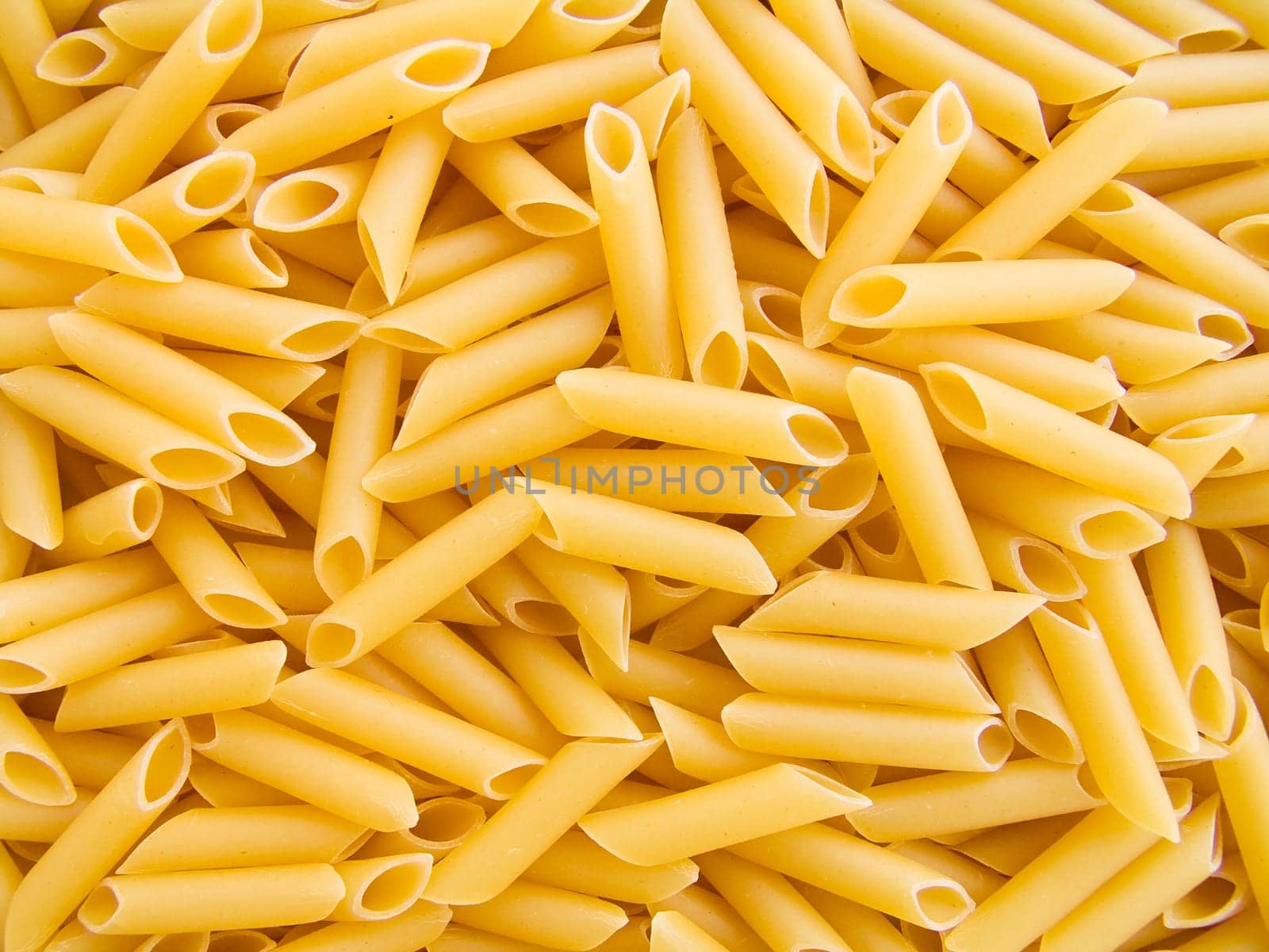 food background a pile of beautiful pasta tubules