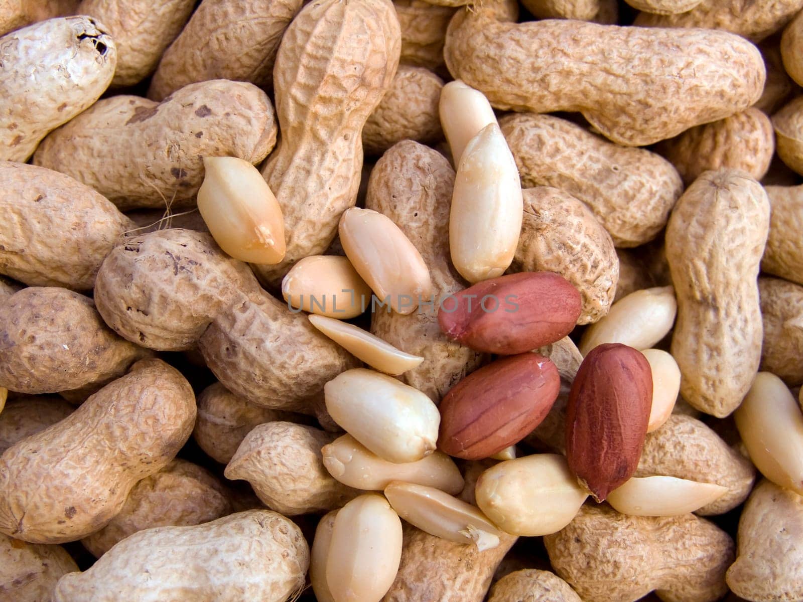 Agricultural background, a pile of beautiful cleared peanut