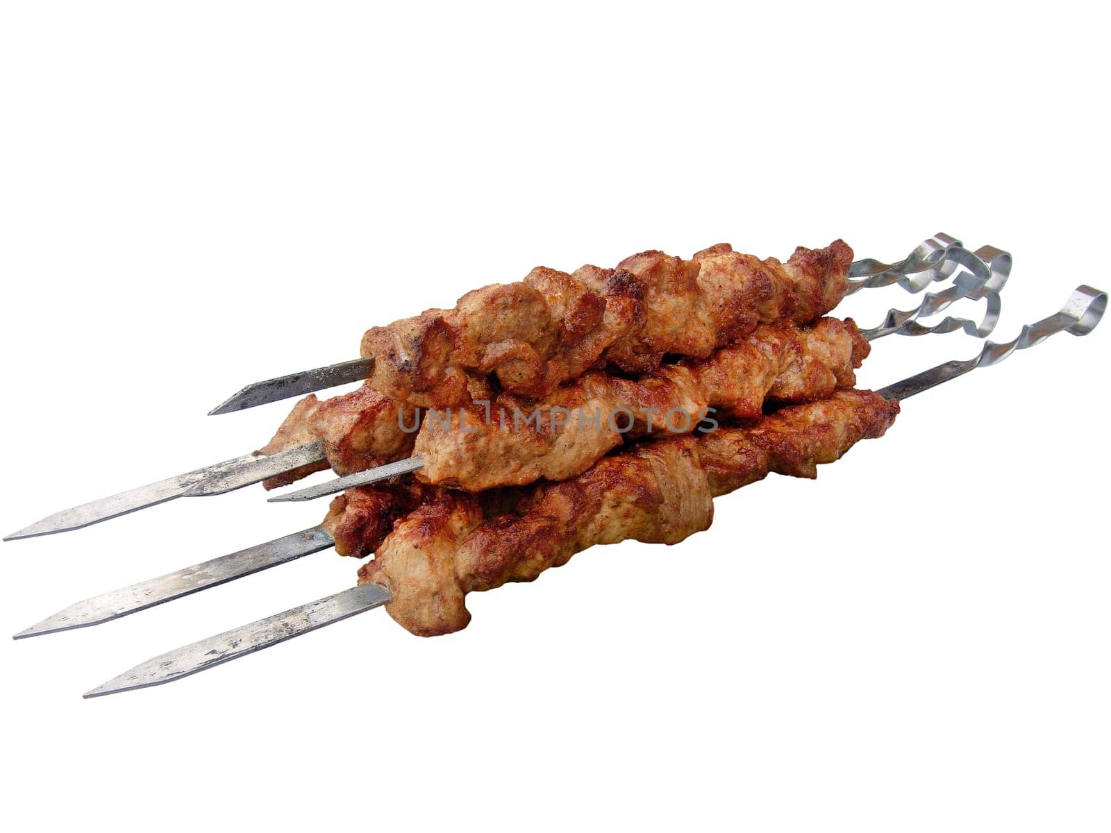 The shish kebab on skewers isolated on the white background