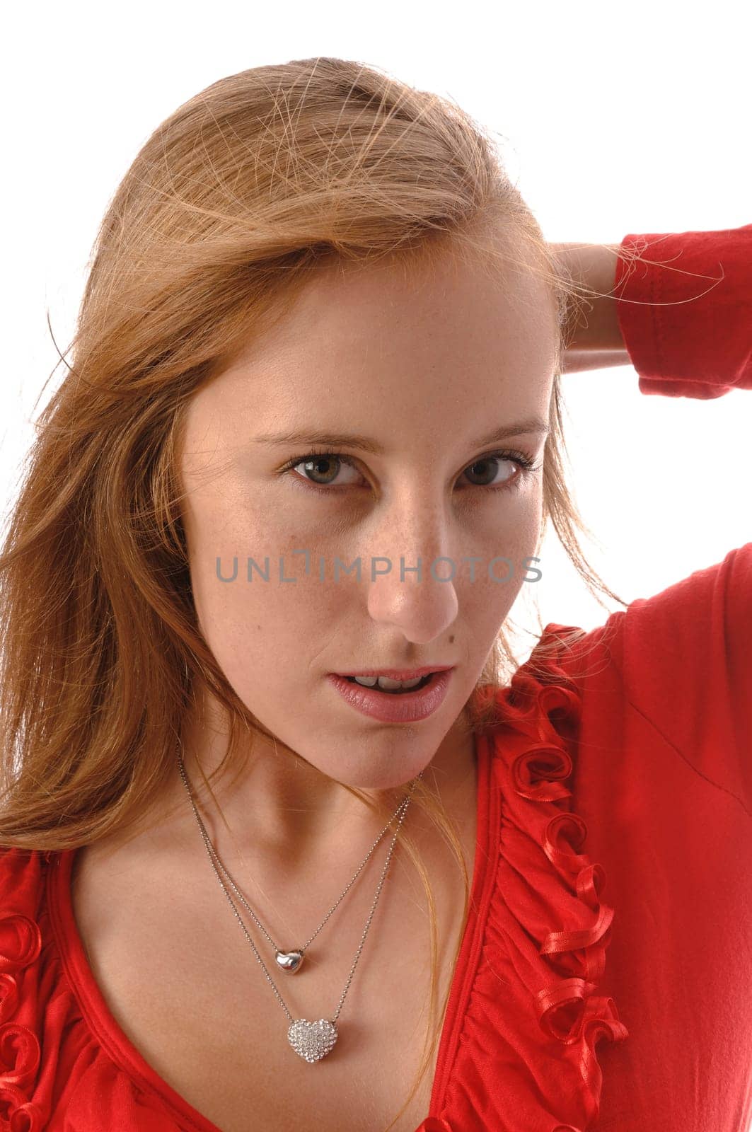 Young woman wears jeans,red clothes and a handbag against a white background