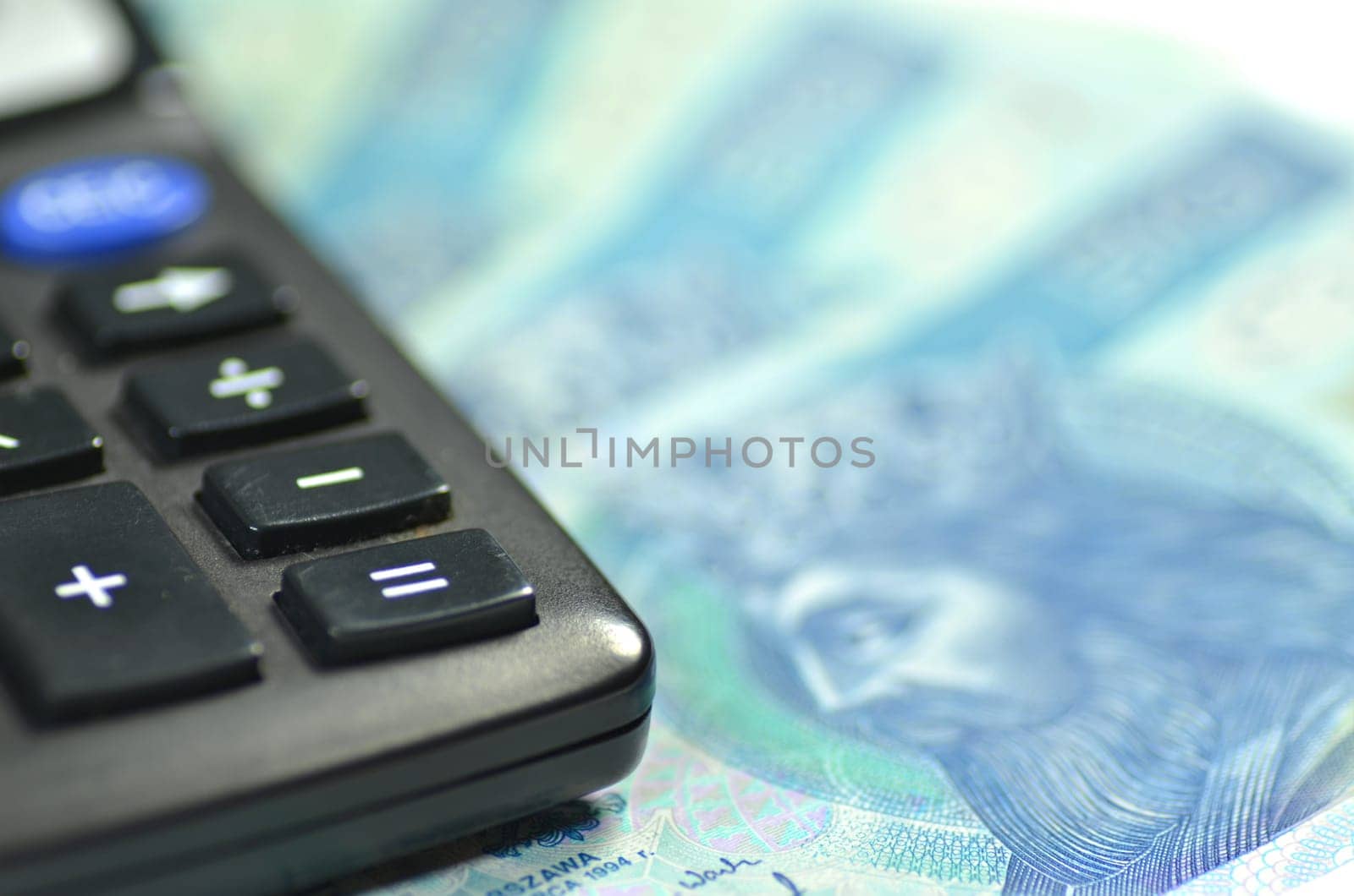 zloty banknotes from Poland and calculator