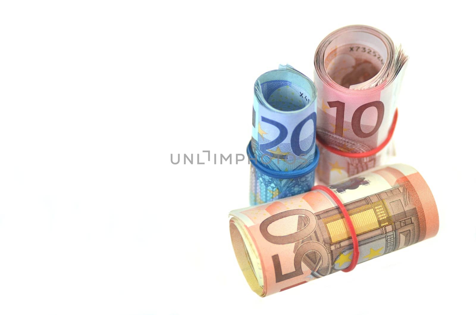 rolls of euro banknotes isolated on white