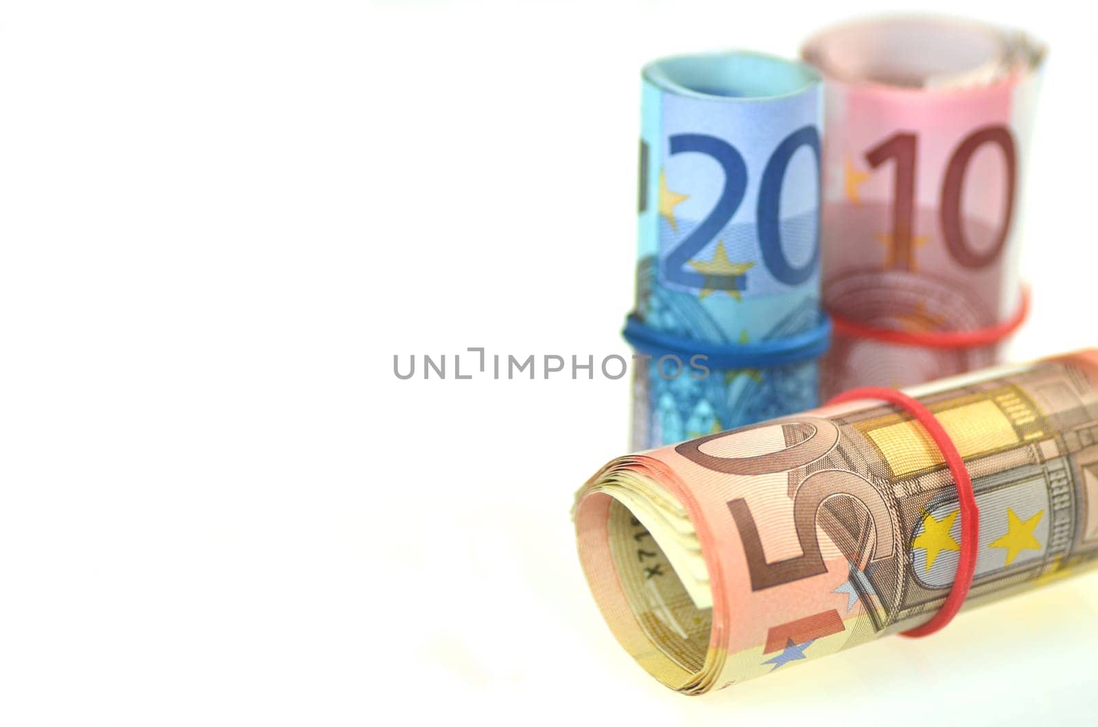 rolls of euro banknotes isolated on white