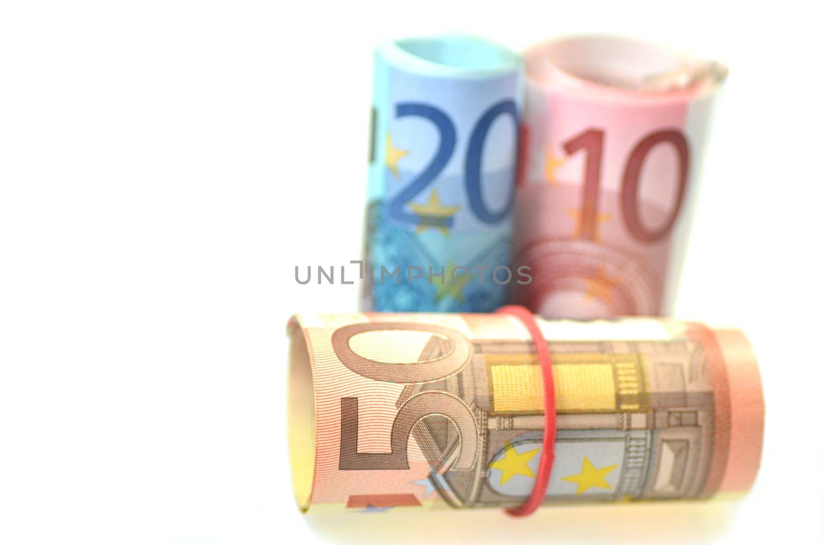 rolls of euro banknotes isolated on white