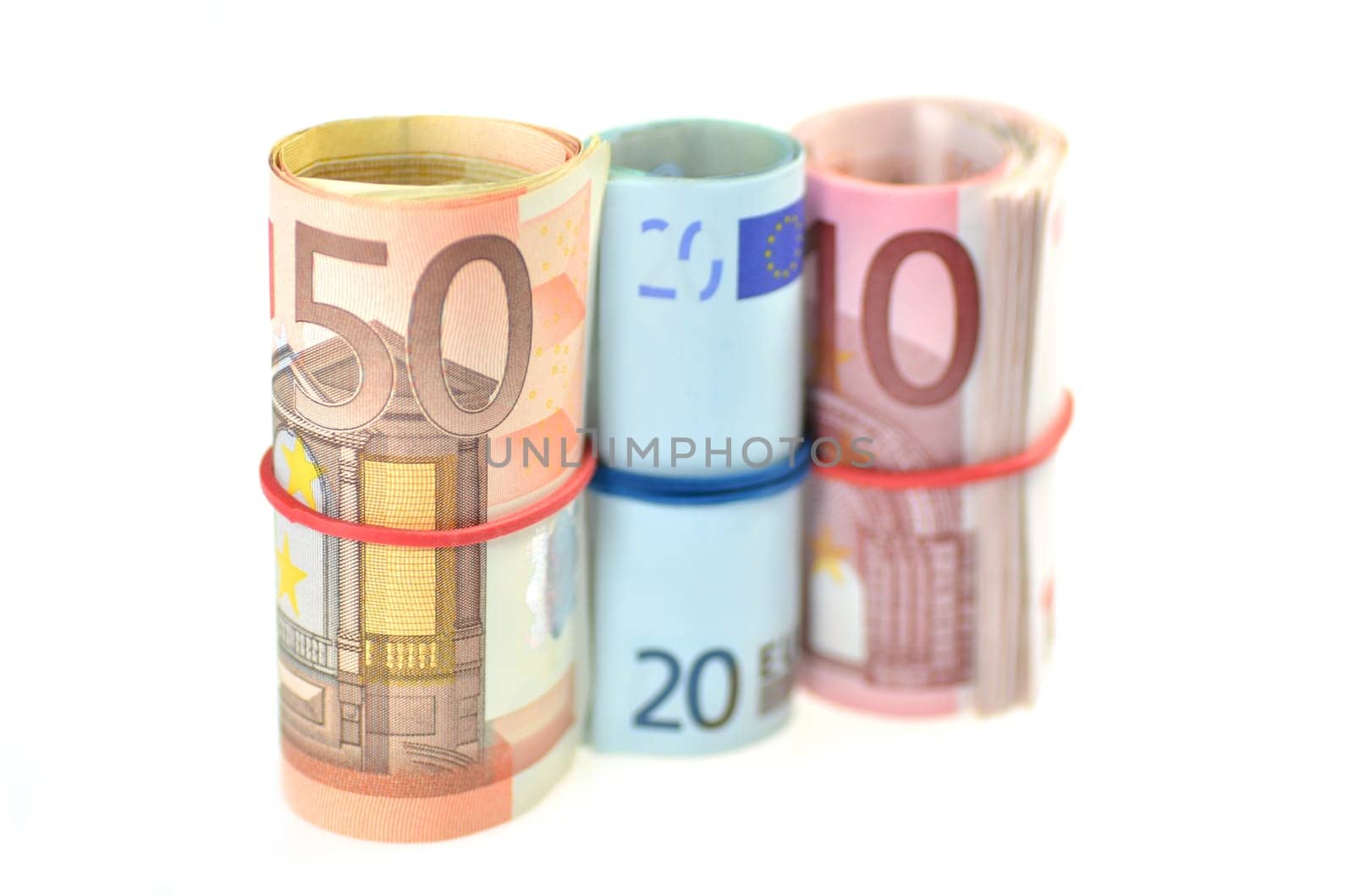 rolls of euro banknotes isolated on white