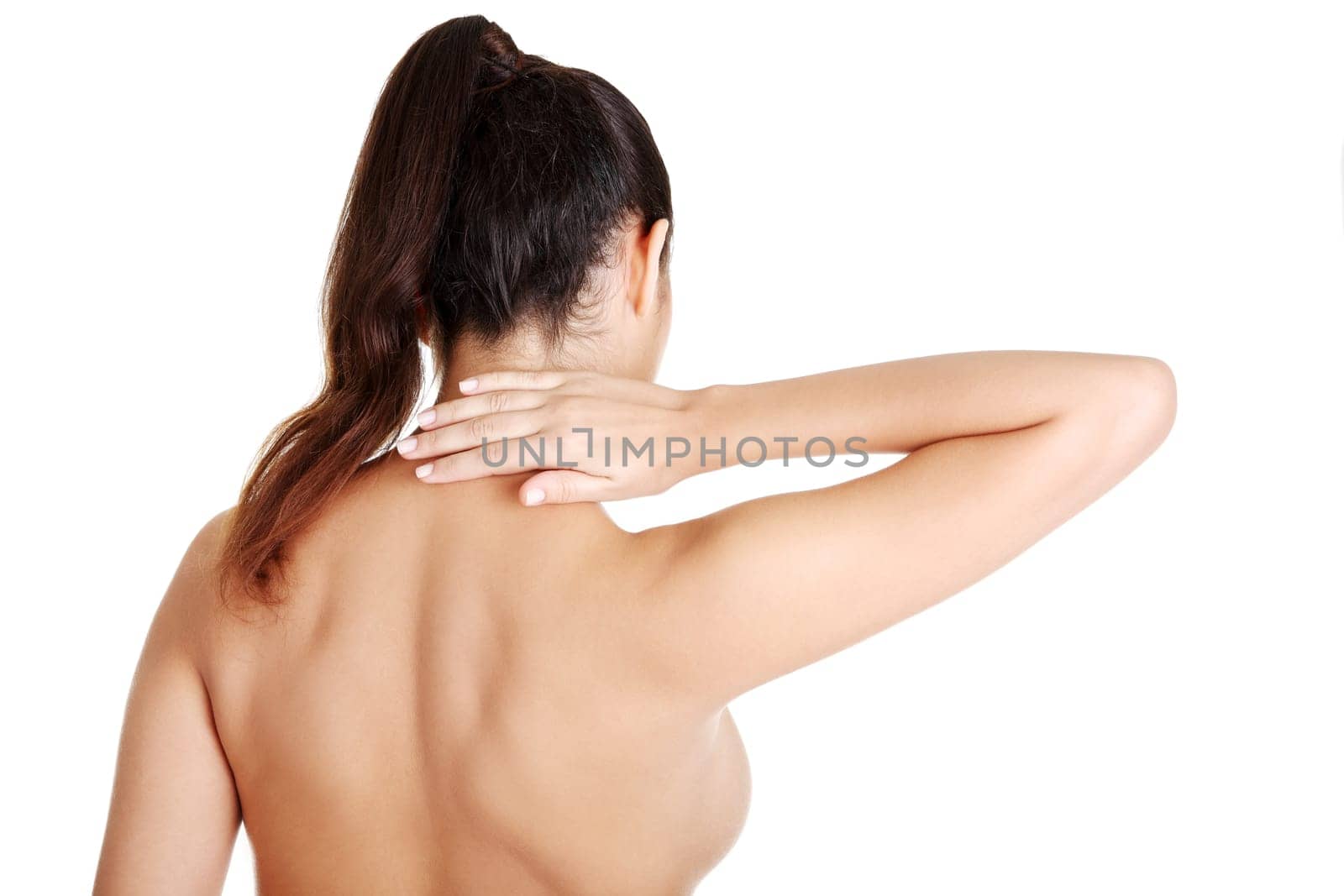 Young woman with pain in her back. Isolated on white