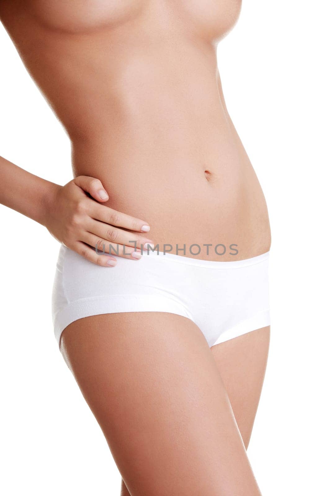 Beautiful female body isolated on white. Sexy young woman in white panties
