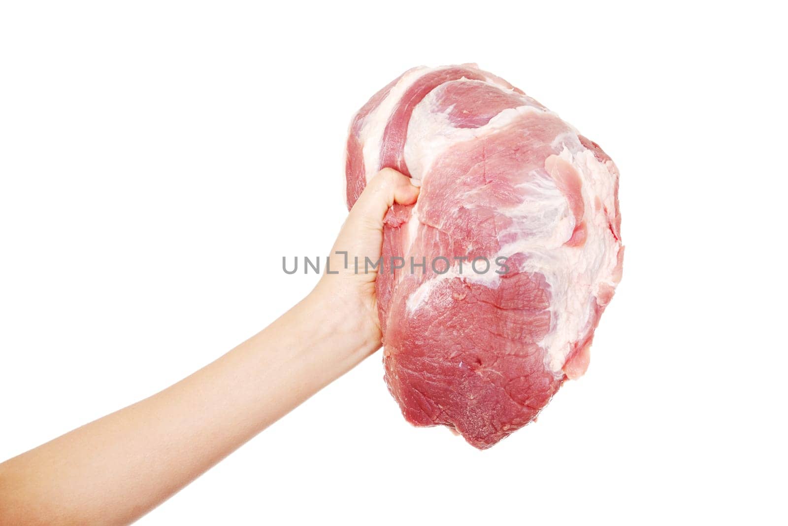Female hand holding big piece of raw meat (pork neck), isolated on white