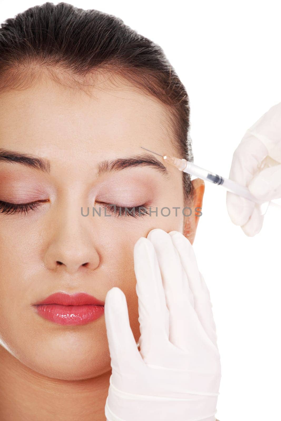 Cosmetic botox injection in the female face, eye and eyebrow zone