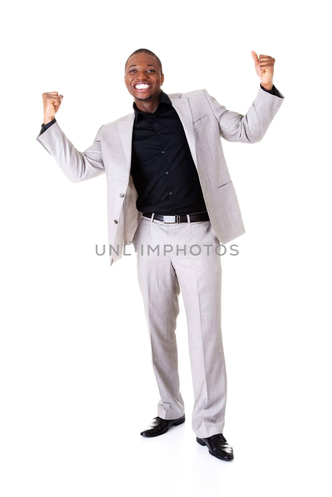 male businessman with hands up,smiling. isolated on white.