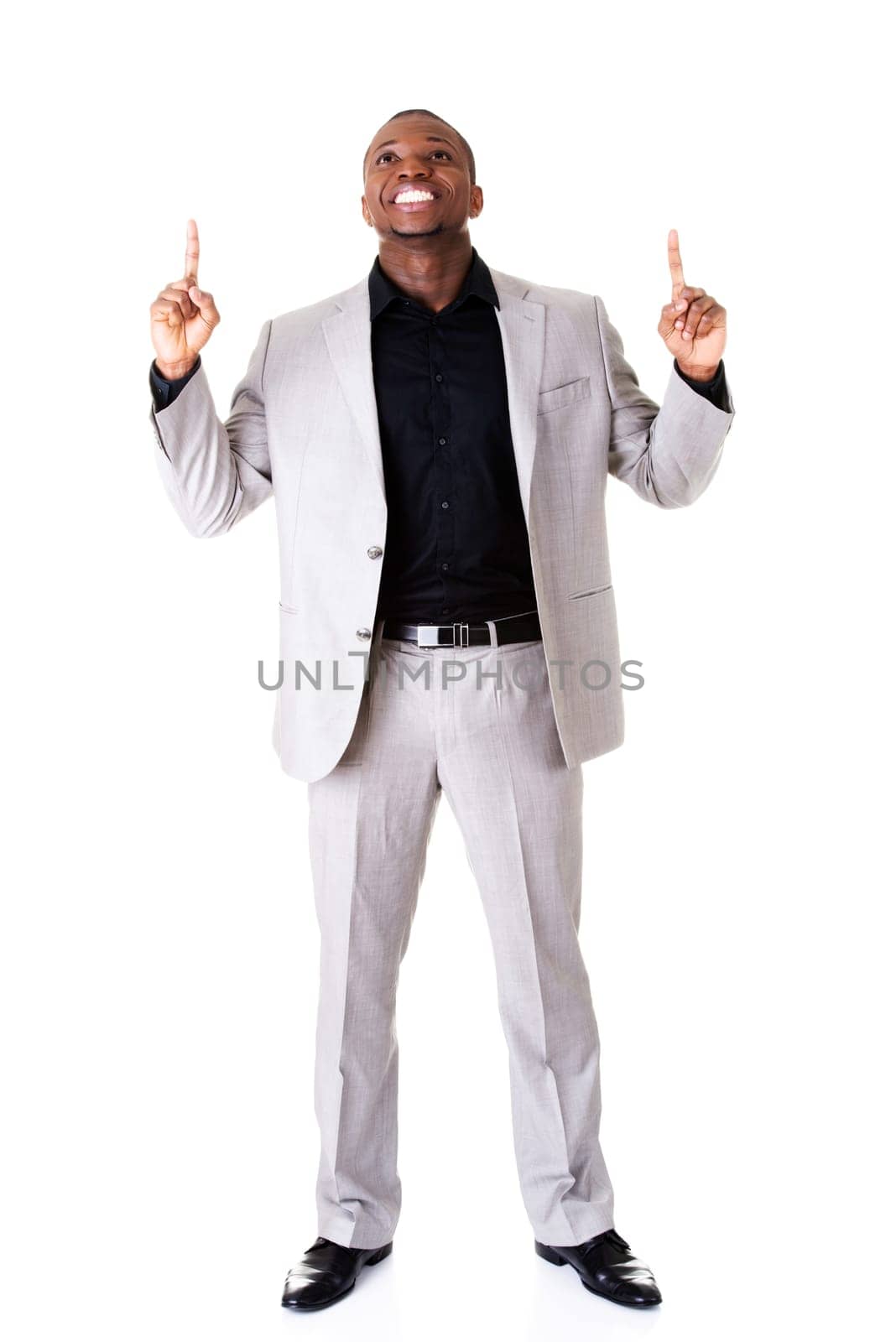 handsome male businessman with fingers pointing up. isolated on white.