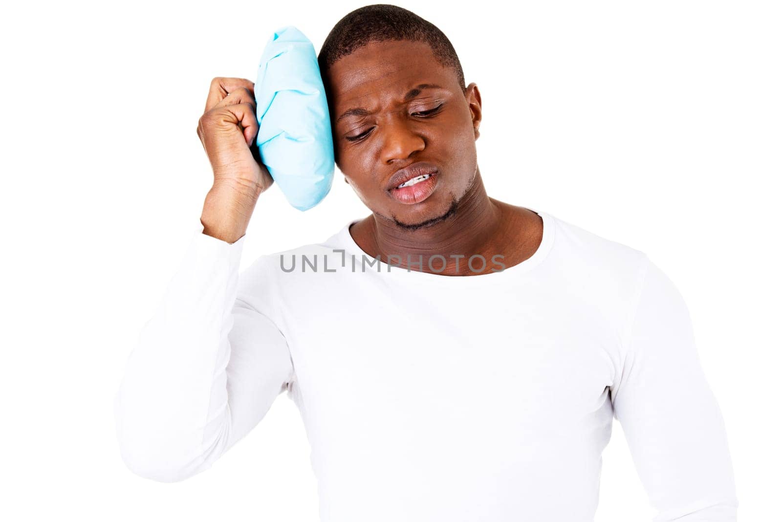 handsome male with headache. isolated on white.