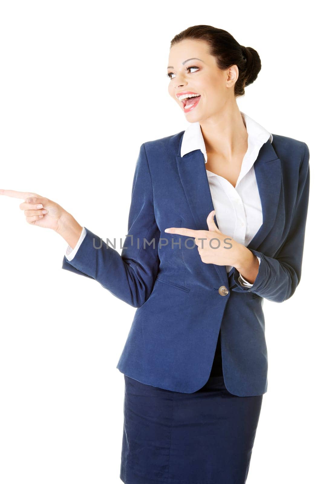 attractive businesswoman pointing. isolated on white.