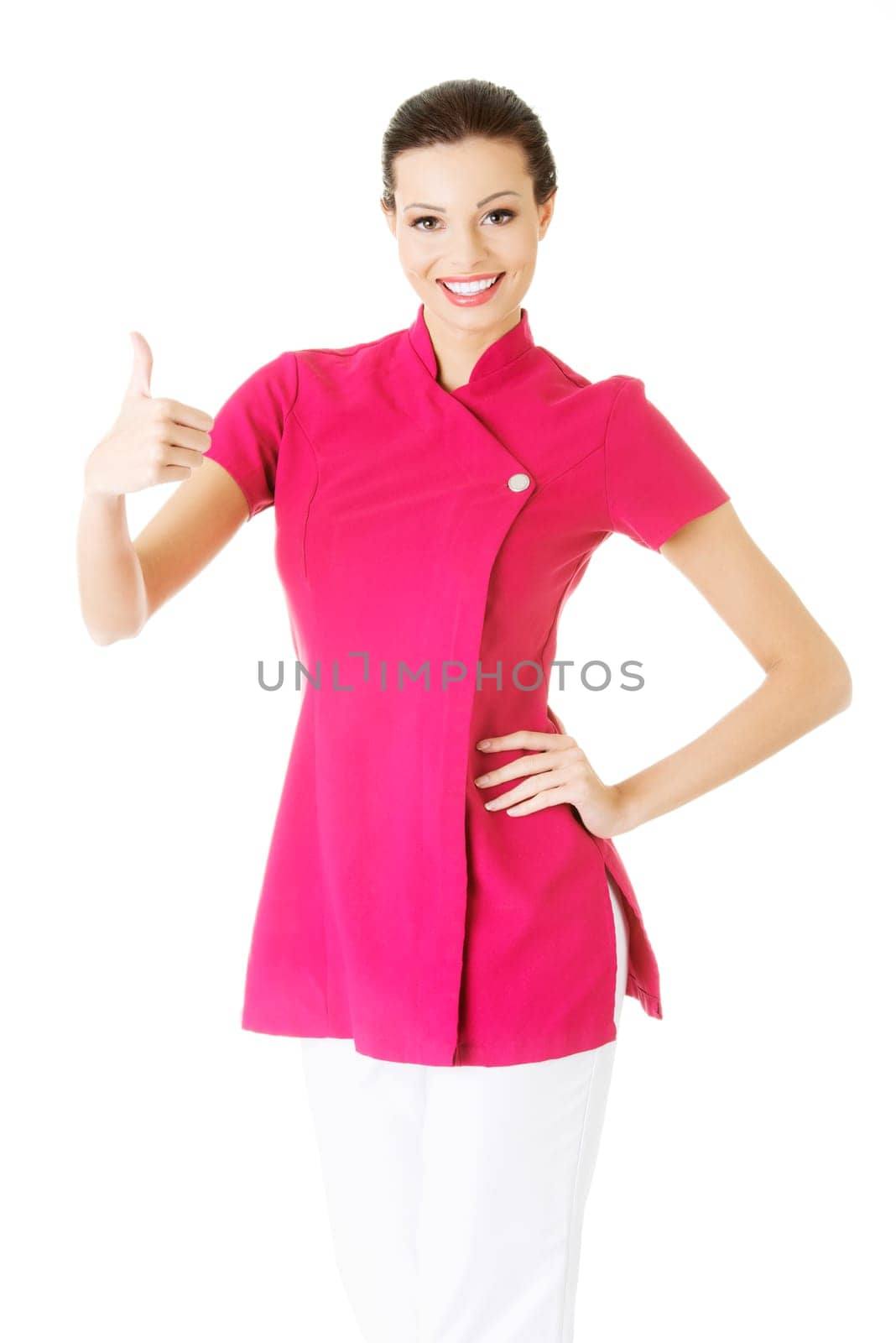 attractive pretty beautician / massause showing ok. isolated on white.