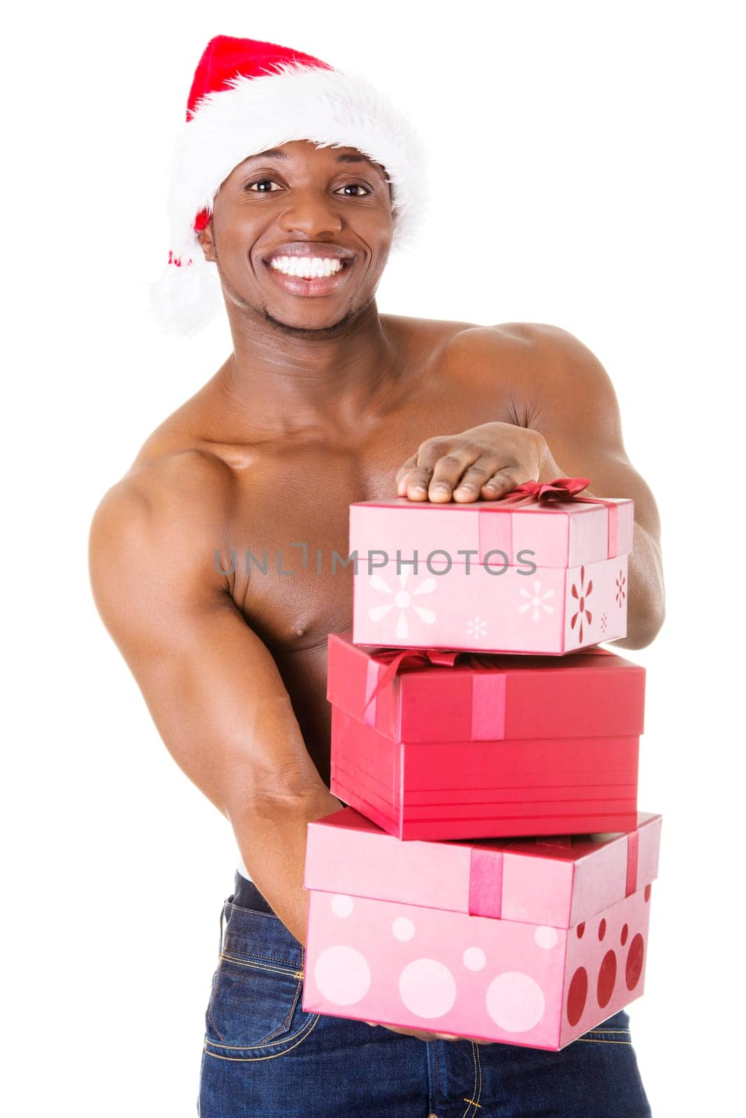 handsome nude man holding gifts and holding santa hat. isolated on white.