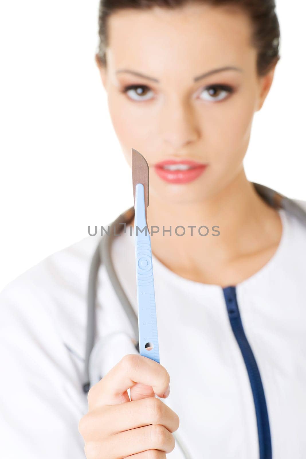 attractive young female doctor with scalpel. isolated on white.