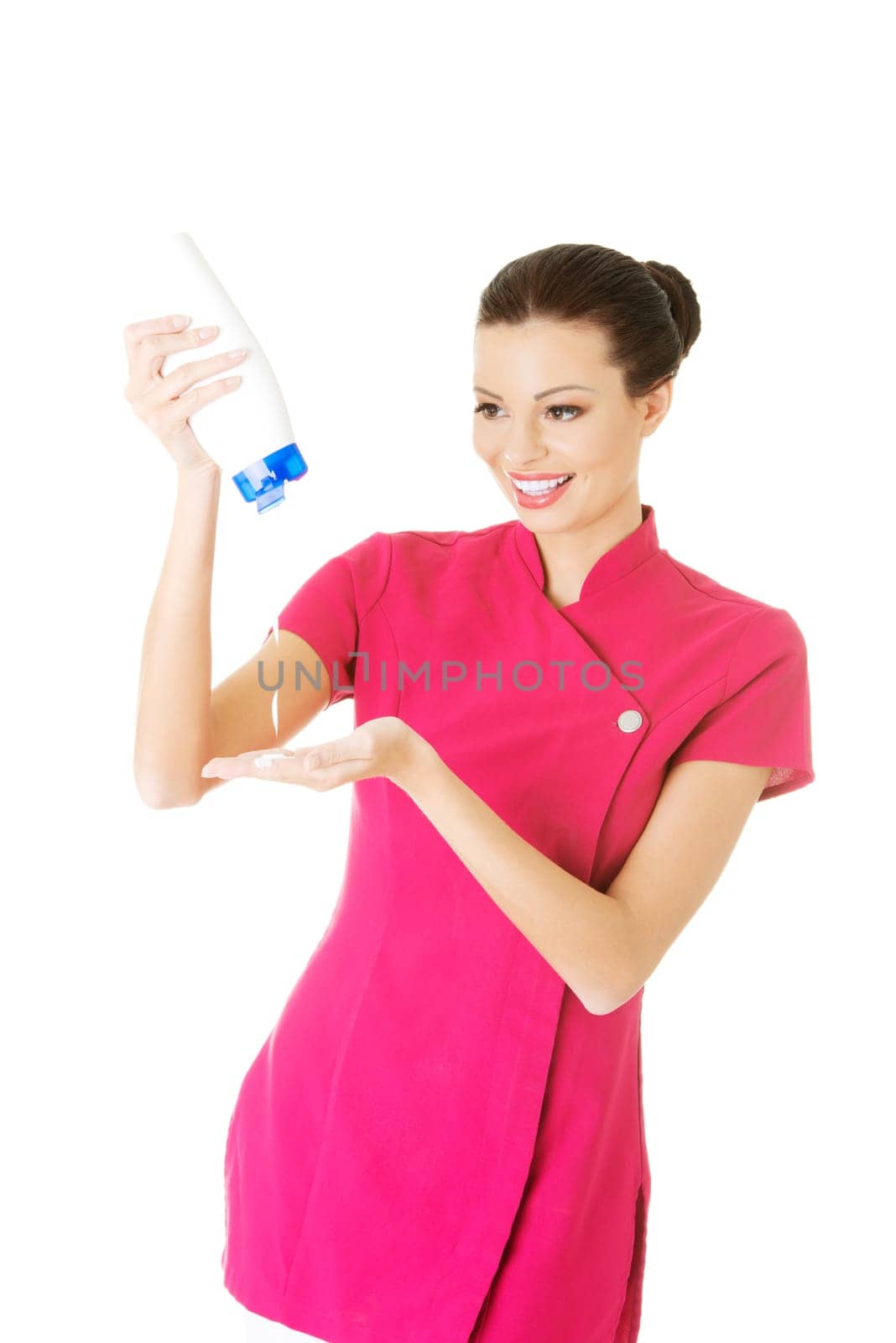 attractive woman holdin body lotion. isolated on white.