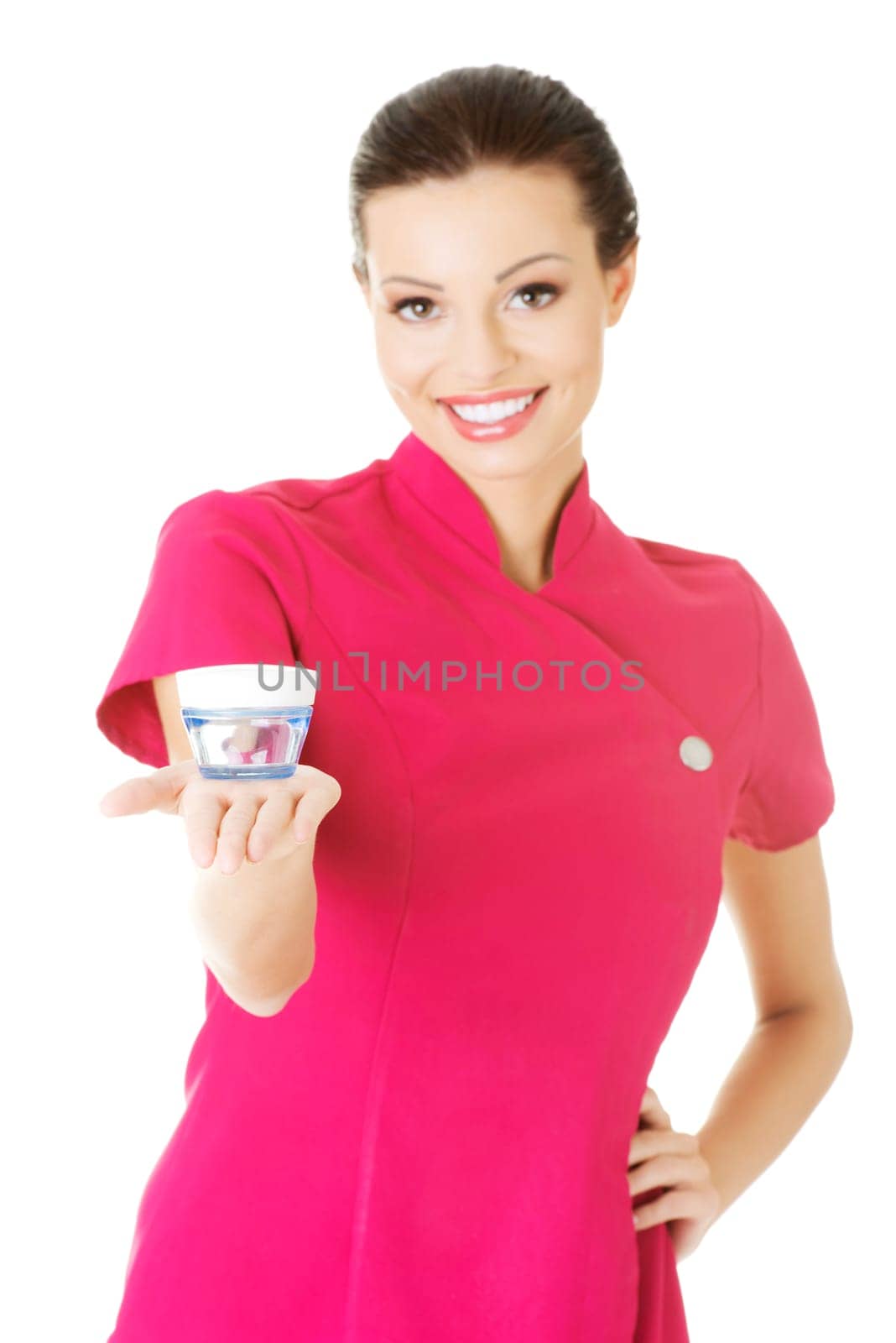 beautiful attractive beautician holding a cream. isolated on white.