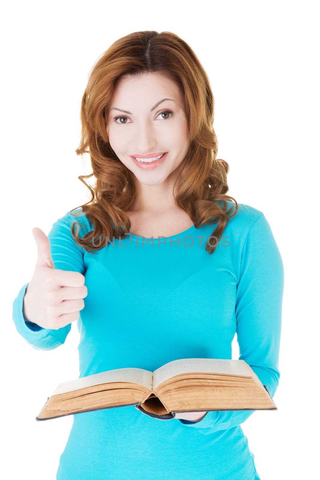beautiful casual woman holding a book and showing ok. isolated on white.