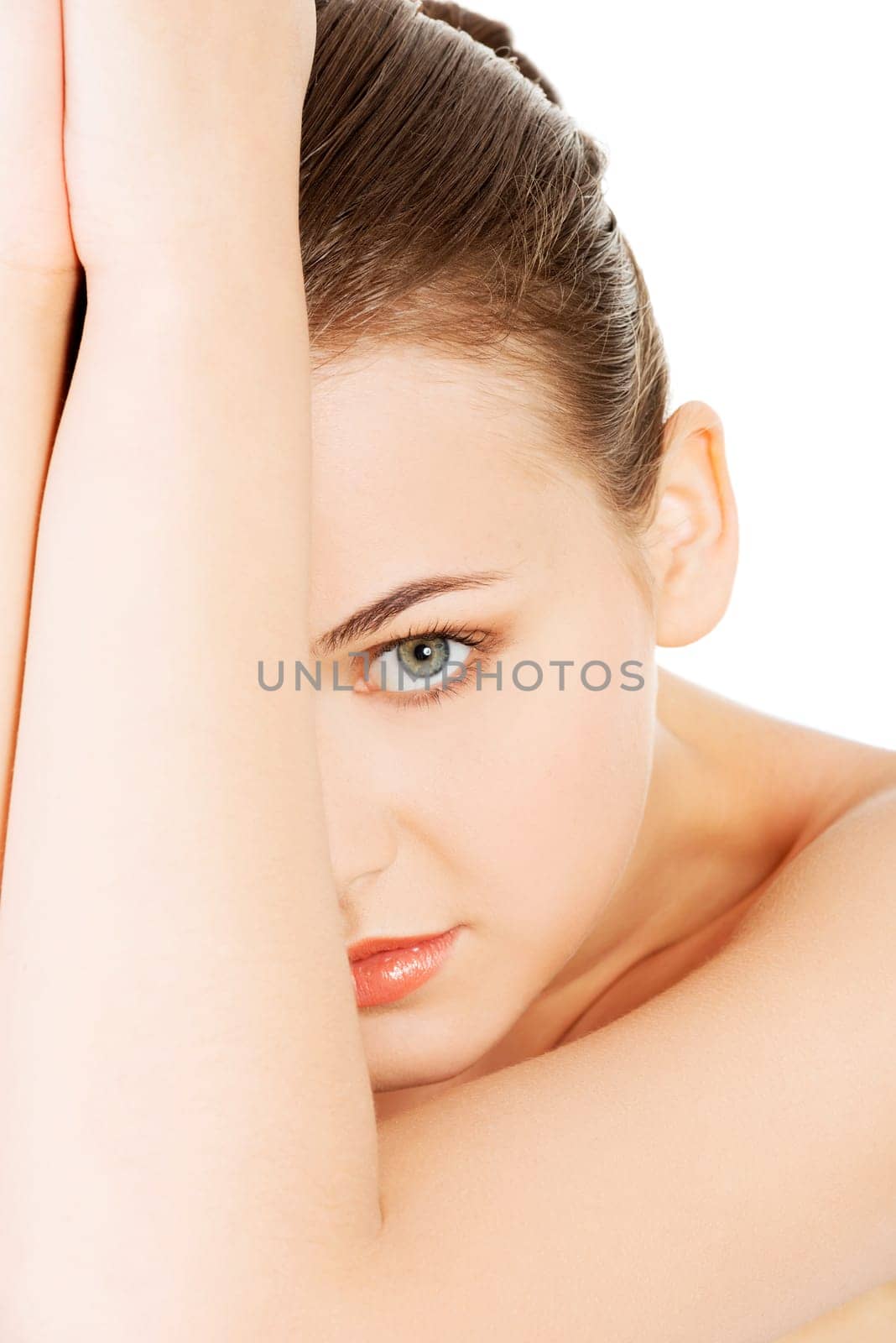 attractive young naked woman's face. portrait. closeup. front view. isolated on white.